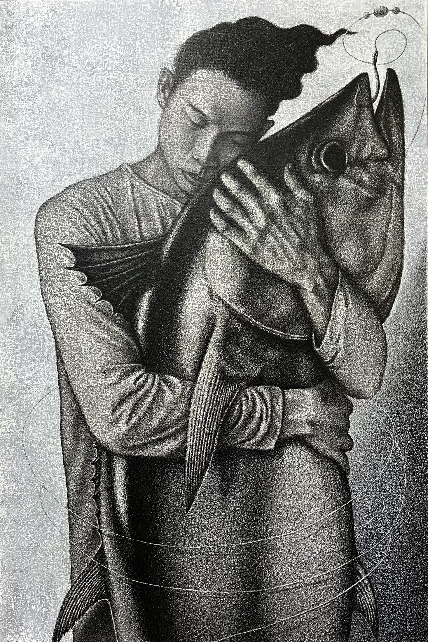 Yakap — a young man embracing a large fish